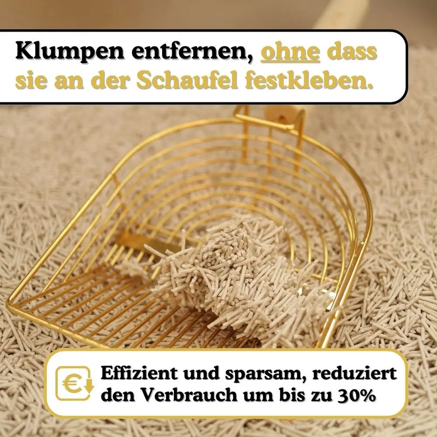 Goldene Schaufel hebt feste Klumpen aus dem Streu